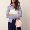 Bolso tipo cubo rígido con ojales Bolso tipo cubo rígido con ojales