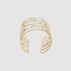 Brazalete rígido cruzado de manga redonda