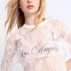 Camiseta oversize de encaje con detalle gráfico
