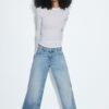 Jeans de talle bajo y pierna Wide Leg con detalle de estrella Jeans de talle bajo y pierna Wide Leg con detalle de estrella