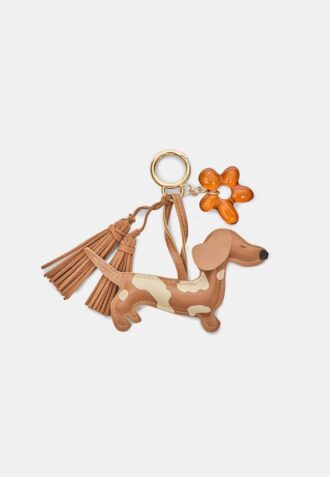 Llavero con colgante de perro y flor