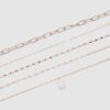 Lote de 5 collares con dijes de piedra rosa