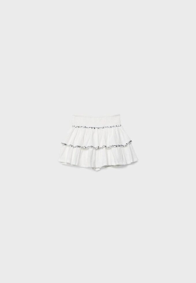 Minifalda con volantes y tachuelas Minifalda con volantes y tachuelas