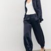 Pantalones acampanados de satén elegantes Pantalones acampanados de satén elegantes