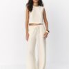 Pantalones con efecto lino y hilos metálicos fluidos Pantalones con efecto lino y hilos metálicos fluidos