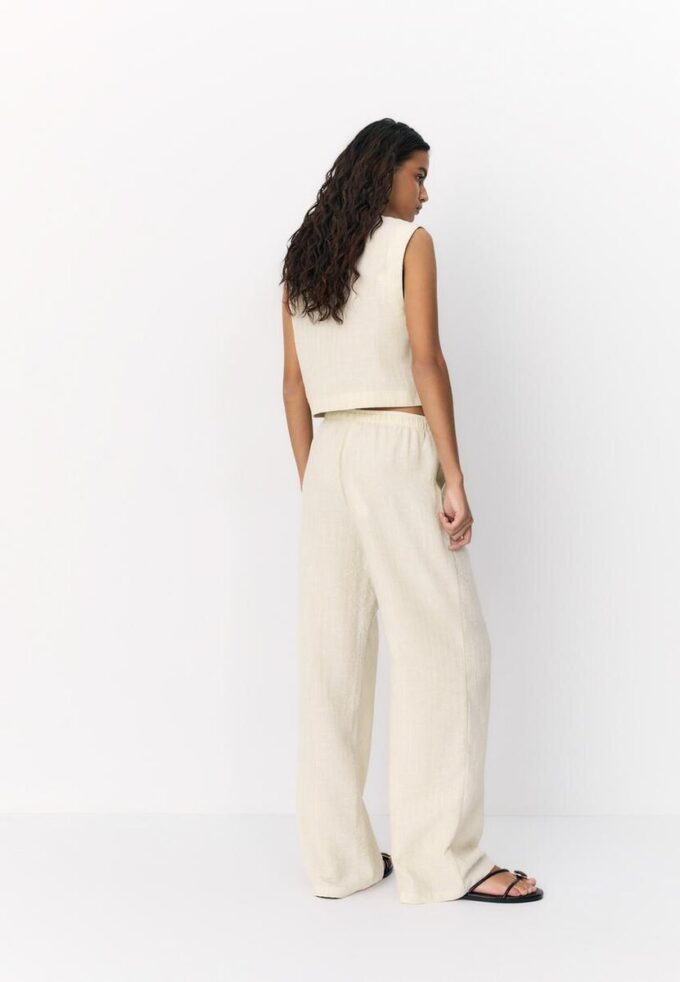 Pantalones con efecto lino y hilos metálicos fluidos Pantalones con efecto lino y hilos metálicos fluidos