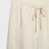 Pantalones con efecto lino y hilos metálicos fluidos Pantalones con efecto lino y hilos metálicos fluidos