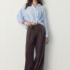 Pantalones fluidos con efecto arrugado y lazo Pantalones fluidos con efecto arrugado y lazo