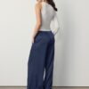 Pantalones fluidos con efecto arrugado y lazo Pantalones fluidos con efecto arrugado y lazo