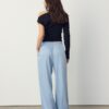 Pantalones fluidos con efecto arrugado y lazo Pantalones fluidos con efecto arrugado y lazo