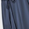 Pantalones fluidos con efecto arrugado y lazo Pantalones fluidos con efecto arrugado y lazo