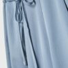 Pantalones fluidos con efecto arrugado y lazo Pantalones fluidos con efecto arrugado y lazo