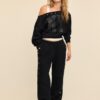 Pantalones jogger con detalles de tachuelas Pantalones jogger con detalles de tachuelas