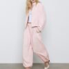 Pantalones sarouel con pinzas y hebilla Pantalones sarouel con pinzas y hebilla