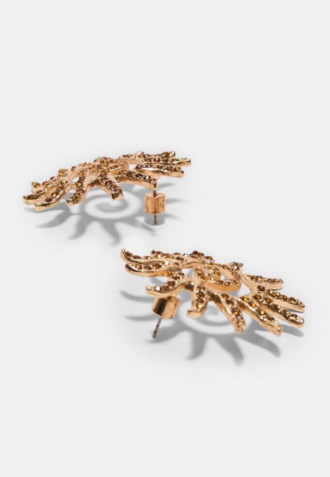 Pendientes pequeños con forma de sol y pedrería Pendientes pequeños con forma de sol y pedrería