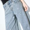 Vaqueros de talle bajo y pierna Wide Leg con pedrería Vaqueros de talle bajo y pierna Wide Leg con pedrería